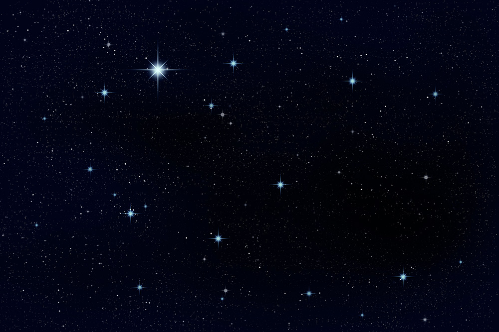 Papier peint photo - Un ciel étoilé scintillant avec de nombreuses étoiles brillantes sur un fond sombre