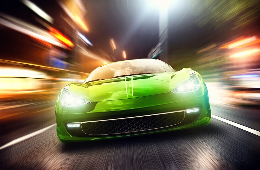Papier peint photo - image dynamique d'une voiture de sport verte sur une route éclairée la nuit