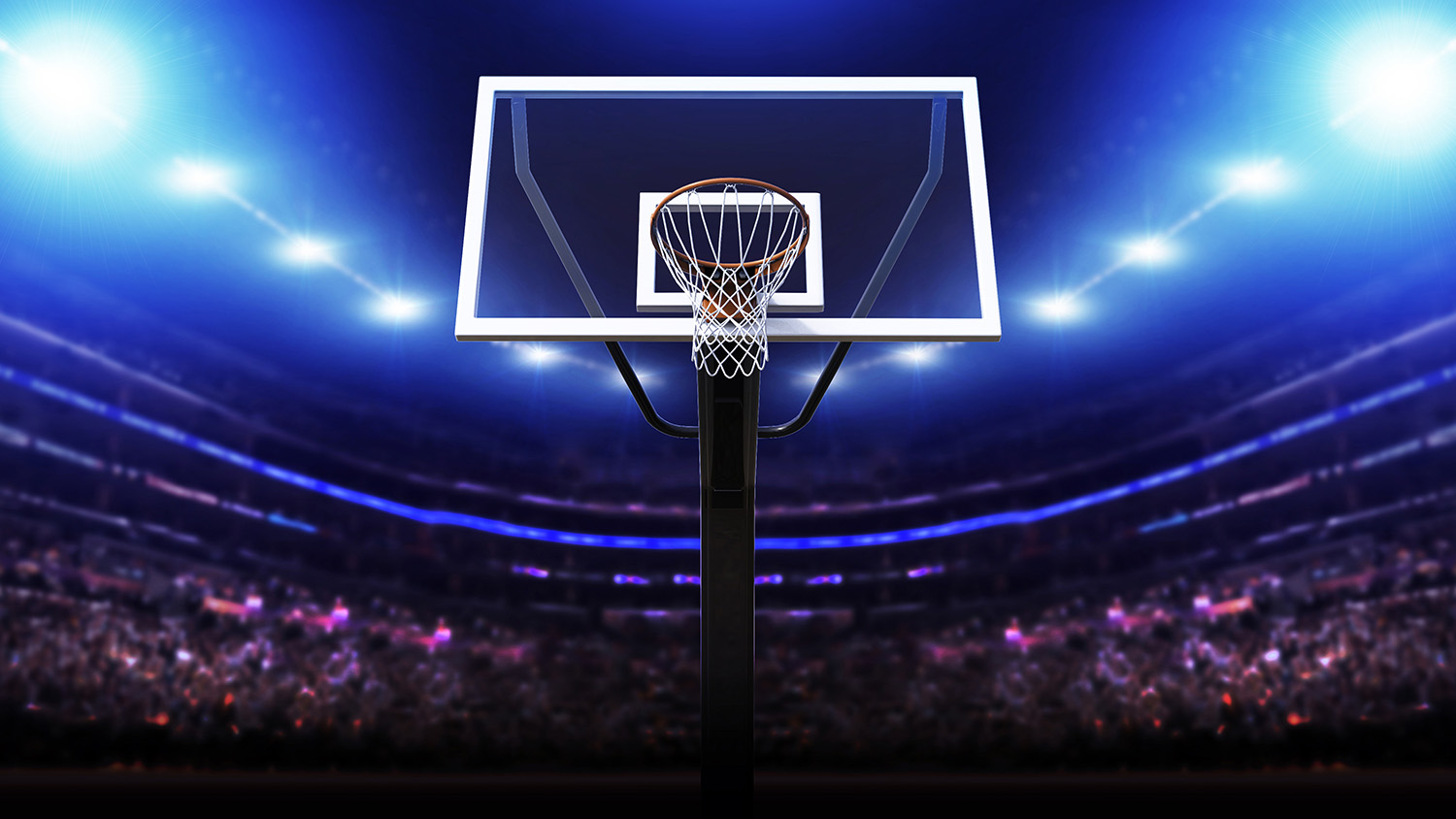 Papier peint photo - Gros plan sur un panier de basket dans une arène sportive brillamment éclairée