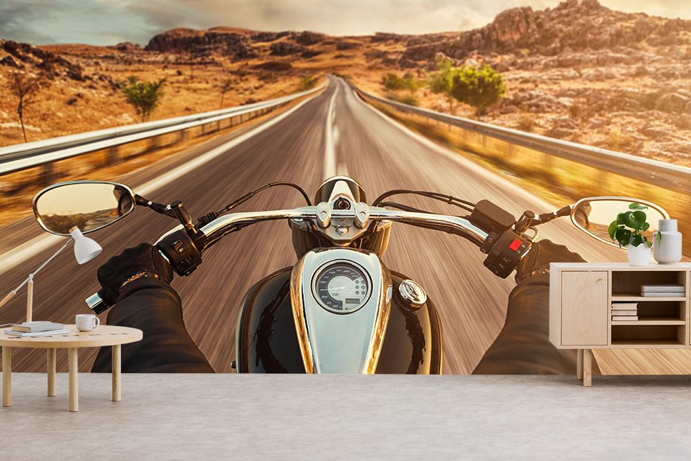 Papier peint photo - motards sur une route de campagne sans fin à travers un paysage rocheux pittoresque
