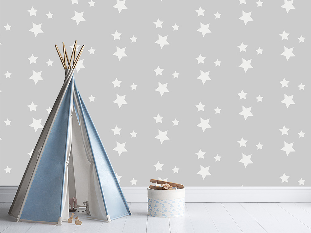 Papier peint photo - tipi d'enfant devant un mur gris avec des étoiles blanches, décoré avec un panier de jouets